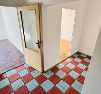 In the 1-room apartment, there are colorful tiles and glass doors.