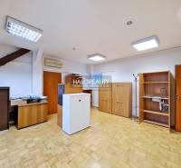 Offices with wood-patterned flooring, wooden furniture, and air conditioning.