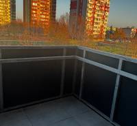 The balcony of a 2-room apartment on Okružná Street in Pezinok with a view of the surrounding apartment buildings.
