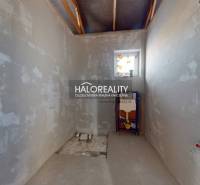 Bare walls of a bathroom under construction in a family house.