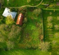 Aerial view of plots in Banská Štiavnica, ideal for living, surrounded by greenery.