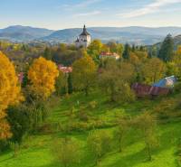 Landscape in Banská Štiavnica - residential plots with a church on a hill, autumn atmosphere.