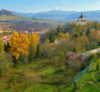 Autumn in Banská Štiavnica with a residential plot surrounded by colorful nature and hills.