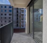 A balcony in a 3-room apartment with a view of the surrounding buildings in Poprad.