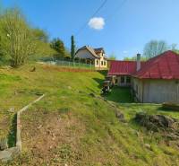 A family house in Štiavnické Bane on Štiavnické Bane street with a grassy plot.