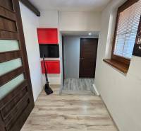 Interior of a family house with a wooden decor floor and modern lighting.