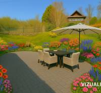 The terrace of a family house in Štiavnické Bane with a flower garden and garden furniture.