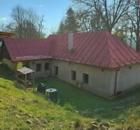 A family house in Štiavnické Bane, Štiavnické Bane, with rural architecture, a garden, and a gazebo.