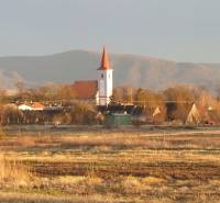 Panorama of the village Studienka on Pod Borovicou Street with a church, an ideal location for living.