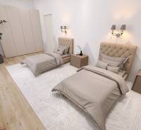 Double bedroom in a family house with wood-patterned flooring and a wardrobe.