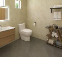 Bathroom with a sink, mirror, and toilet in a family house. Floor with wood decor.