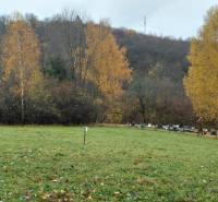 Autumn at the recreational grounds in Konské pod Podhradím with forest and greenery on the hill.