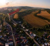 Aerial view of agricultural and forest lands around Rokycany at sunset.