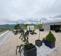 A spacious terrace with a view of the hills in Rajecké Teplice on M. R. Štefánika Street.