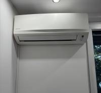 Air conditioning in a white interior of a 2-room apartment with modern lighting.