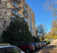 Apartment building with parked cars on Zálužická Street in Bratislava - Ružinov.