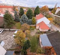 Aerial view from a multi-room apartment in Komárno of the courtyard and surrounding buildings.