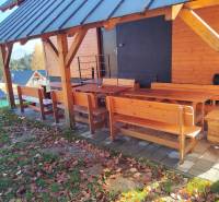 Wooden terrace of the cottage in Stráne, Martin, with outdoor seating surrounded by nature.