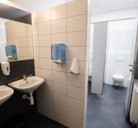 Offices: Sinks and toilet in areas with tiling and dispensers.