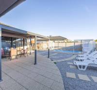 A family house in Most pri Bratislave with a terrace, gazebo, and swimming pool.