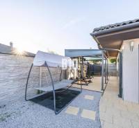 A family house in Most pri Bratislave with a terrace, an outdoor gym, and a swing.