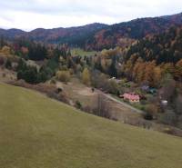 A landscape with an autumn forest and houses on recreational plots in Čertov, Lazy pod Makytou.