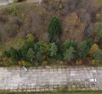 Aerial view of a paved area surrounded by greenery in the recreational grounds Čertov, Lazy pod Makytou.