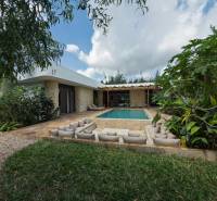 A house with a swimming pool surrounded by greenery on Paje Street in the Unguja South Region.