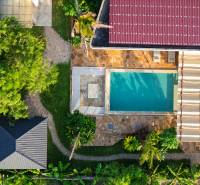 Aerial view of house construction with a swimming pool in the suburb of Paje, Unguja South Region.