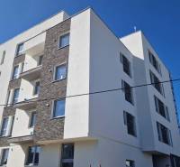 The exterior of the apartment building on Športová Street in Galanta, facade with light walls.