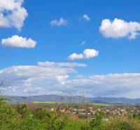 Landscape with a view of Land - housing in Dolné Žemberovce, Žemberovce, with a blue sky.