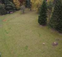 Recreational plots at Čertov in Lazy pod Makytou, surrounded by nature and a road.