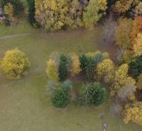 Autumn view of recreational plots in Lazy pod Makytou, Čertov, surrounded by trees of various colors.