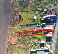 A residential plot in Radnovce surrounded by nature, close to the road.