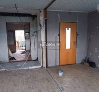 A room with a wooden decor floor and unfinished walls at Recreational Grounds.