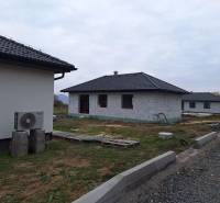 A family house in Vyšná Šebastová, Prešov, under construction, with dark roof tiles.