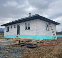 A family house under construction on Vyšná Šebastová street, with construction materials and an unfinished garden.