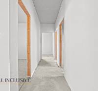 Unplastered hallway in a family house with surfaces ready for finishing.