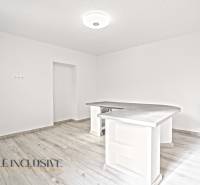 A kitchen with a wooden decor floor in a family house, minimalist bar counter.