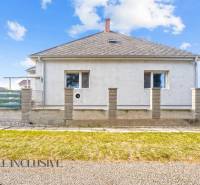 A family house in Veľké Kosihy with a simple facade and a landscaped outdoor area.