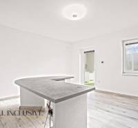 Interior of a family house with a counter and floor with wooden decor.