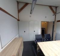 Offices with a desk, black chairs, cabinets, and a whiteboard.