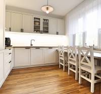 The kitchen in a 3-room apartment with white cabinets and a wood-patterned floor.