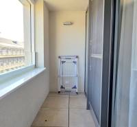 Balcony of a 2-room apartment with white tiles and a view of the street in Bratislava - Staré Mesto, Bezručova.