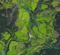 Aerial view of agricultural and forest lands around the village of Poniky.