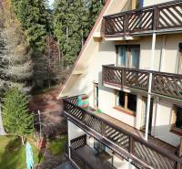 The exterior of the building with wooden balconies in the town of Donovaly on Donovaly Spiežovecc Street.