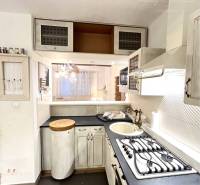 A kitchen with a kitchenette and a gas stove in a 3-room apartment.