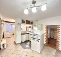 Open space of a 3-room apartment with tiles and a bright interior.