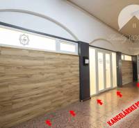 Commercial premises with a tiled floor and wood decor, suitable for office use.