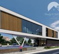 Modern building, glass walls, street, greenery, people outside, urban living.